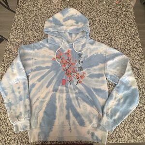 Blue and White Tie-Dye Hoodie with Floral Design